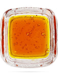 Image of a Calyx jar containing 3.5 grams of Broad Spectrum CBD Distillate.