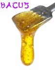 Image of Abacus CBD Live Resin dripping from dab tool.