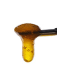 Image of Ak47 CBD Live Resin dripping from a dab tool.