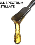 Image of Full Spectrum CBD Distillate dripping from dab tool.
