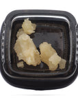 Image of a Calyx jar containing 1 gram of Sour Suver Haze CBD Wax.