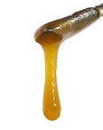 Image of Super Sour Space Candy CBD Live Resin dripping from a dab tool