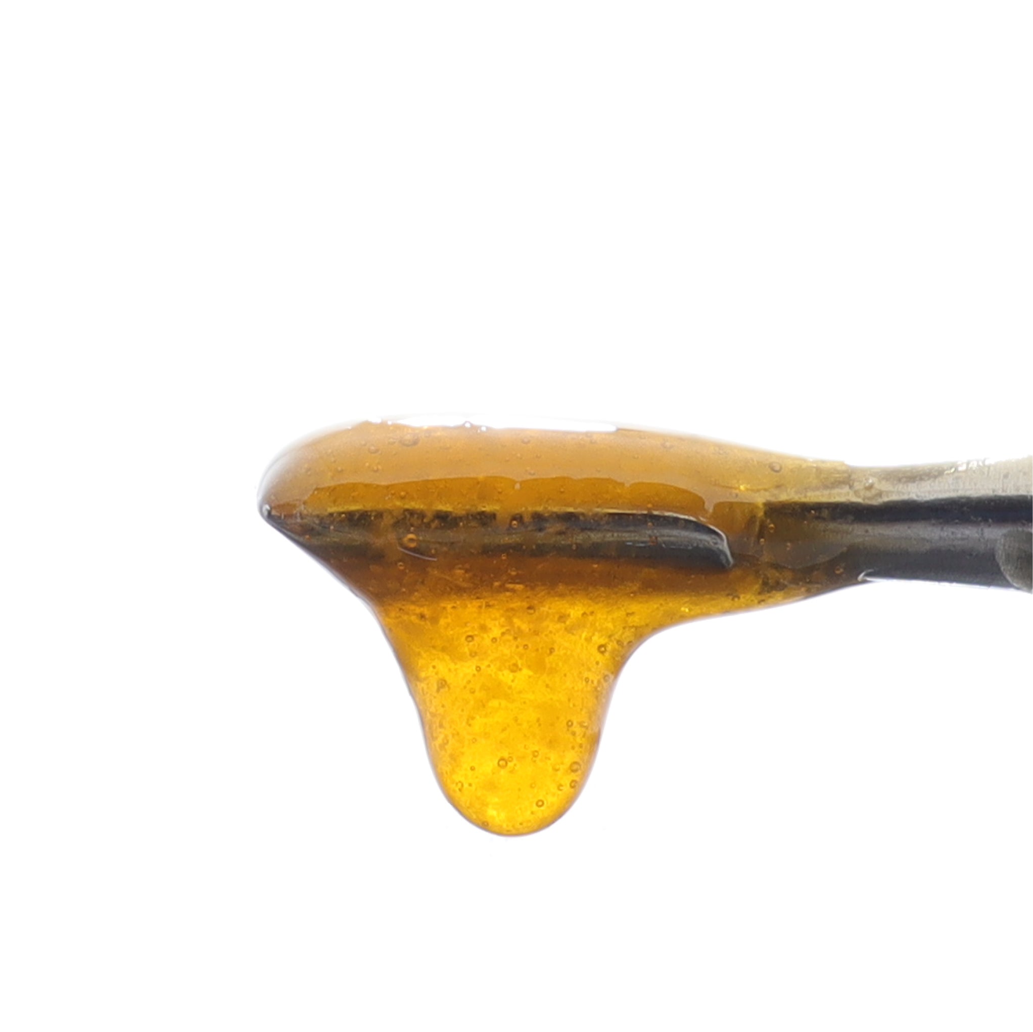 Close up image of Abacus CBD BHO Wax dripping from a dab tool.