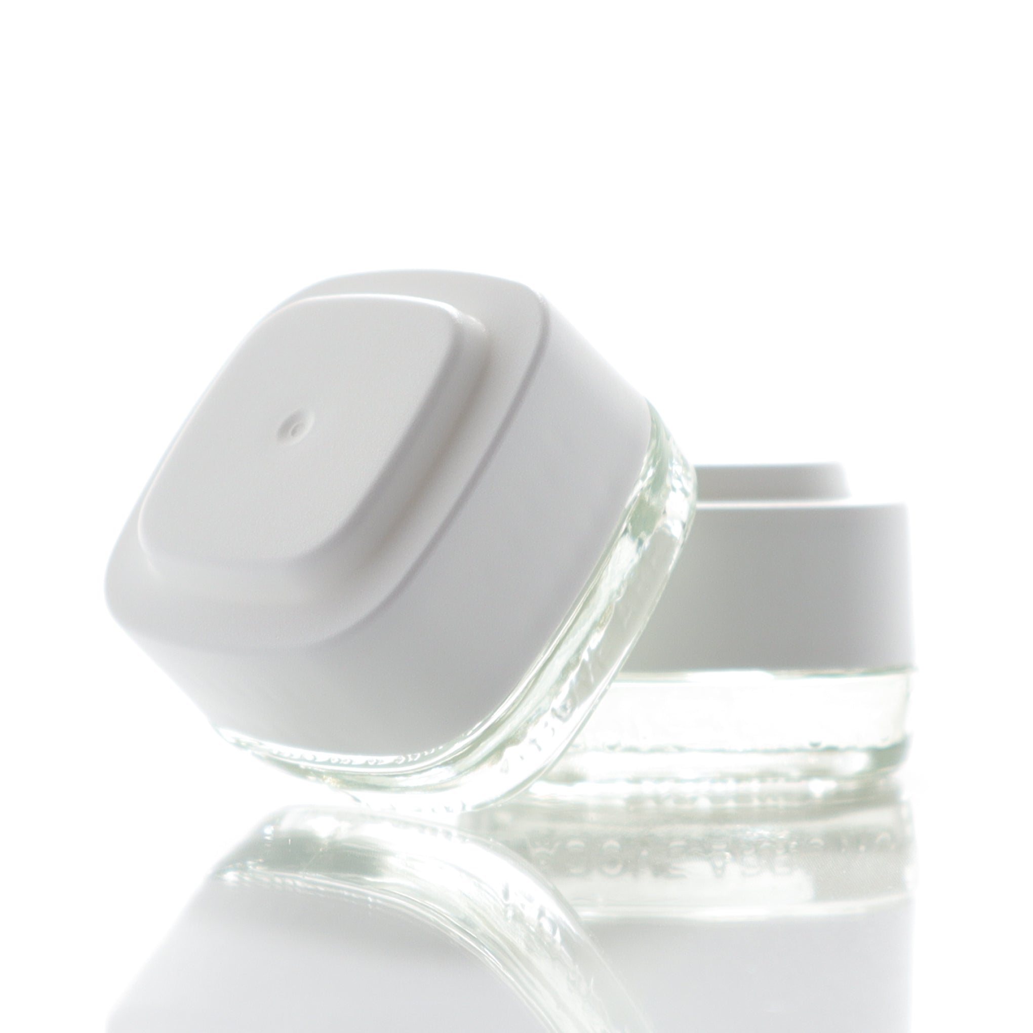 Clear 7ml Calyx concentrate containers with white lids