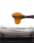 Image of Hawaiian Haze CBD Live Resin dripping from a dab tool.