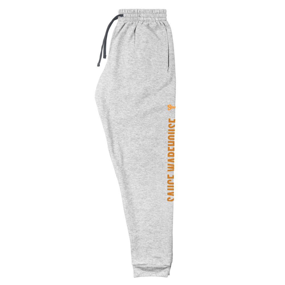Athletic Heather Sauce Warehouse x Jerzeez joggers. The outside of each leg features a Sauce Warehouse logo with &quot;Sauce Warehouse&quot; printed along the outside of the leg. Shop CBD concentrates, clothing, and dabbing accessories at Sauce Warehouse