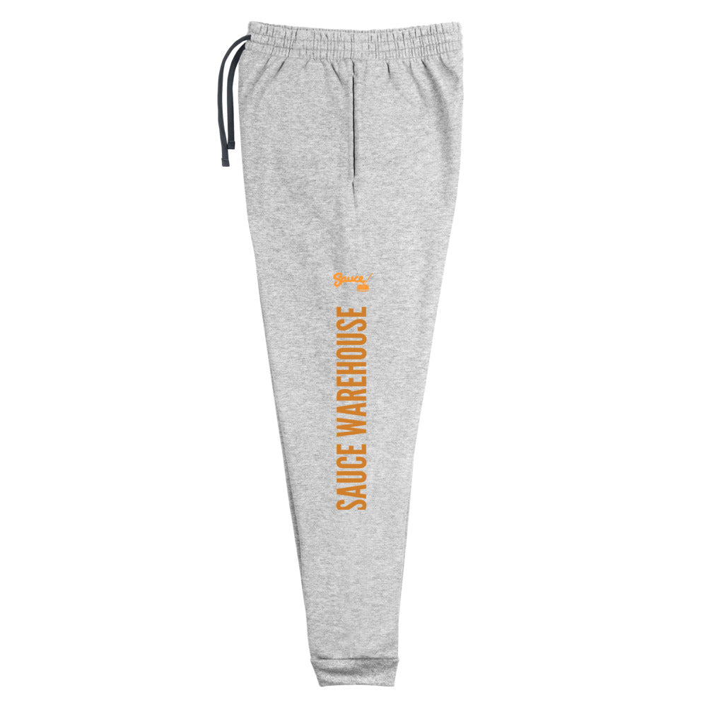 Heather Grey Sauce Warehouse x Jerzeez joggers. The outside of each leg features a Sauce Warehouse logo with "Sauce Warehouse" printed along the outside of the leg. Shop CBD concentrates, clothing, and dabbing accessories at Sauce Warehouse