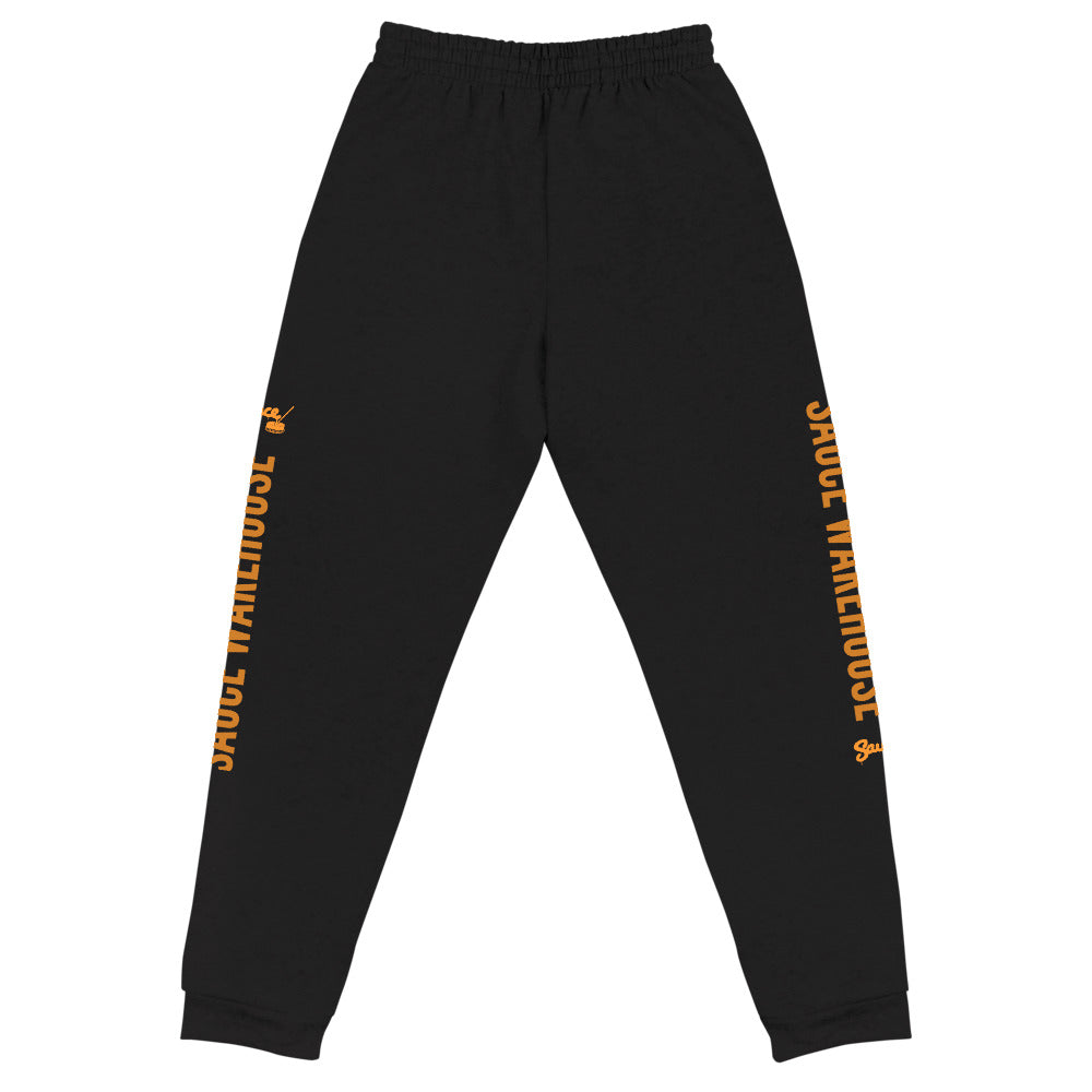 Black Sauce Warehouse x Jerzeez joggers. The outside of each leg features a Sauce Warehouse logo with &quot;Sauce Warehouse&quot; printed along the outside of the leg. Shop CBD concentrates, clothing, and dabbing accessories at Sauce Warehouse