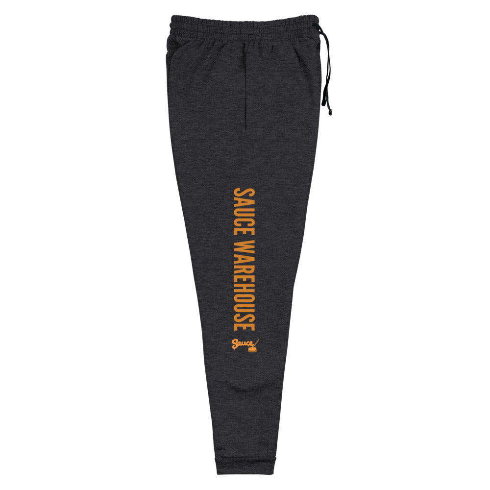Black Heather Sauce Warehouse x Jerzeez joggers. The outside of each leg features a Sauce Warehouse logo with &quot;Sauce Warehouse&quot; printed along the outside of the leg. Shop CBD concentrates, clothing, and dabbing accessories at Sauce Warehouse