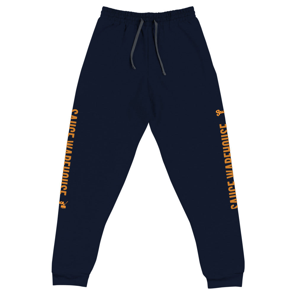 Navy Blue Sauce Warehouse x Jerzeez joggers. The outside of each leg features a Sauce Warehouse logo with &quot;Sauce Warehouse&quot; printed along the outside of the leg. Shop CBD concentrates, clothing, and dabbing accessories at Sauce Warehouse