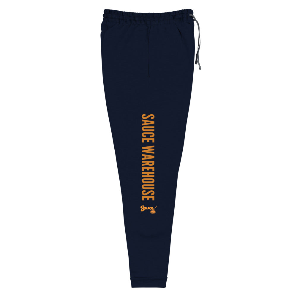 Navy Blue Sauce Warehouse x Jerzeez joggers. The outside of each leg features a Sauce Warehouse logo with "Sauce Warehouse" printed along the outside of the leg. Shop CBD concentrates, clothing, and dabbing accessories at Sauce Warehouse